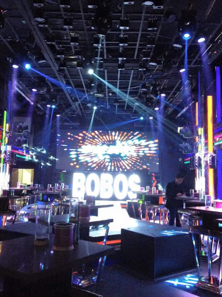 A large LED screen and lighting rig on a concert stage installed by Myba
